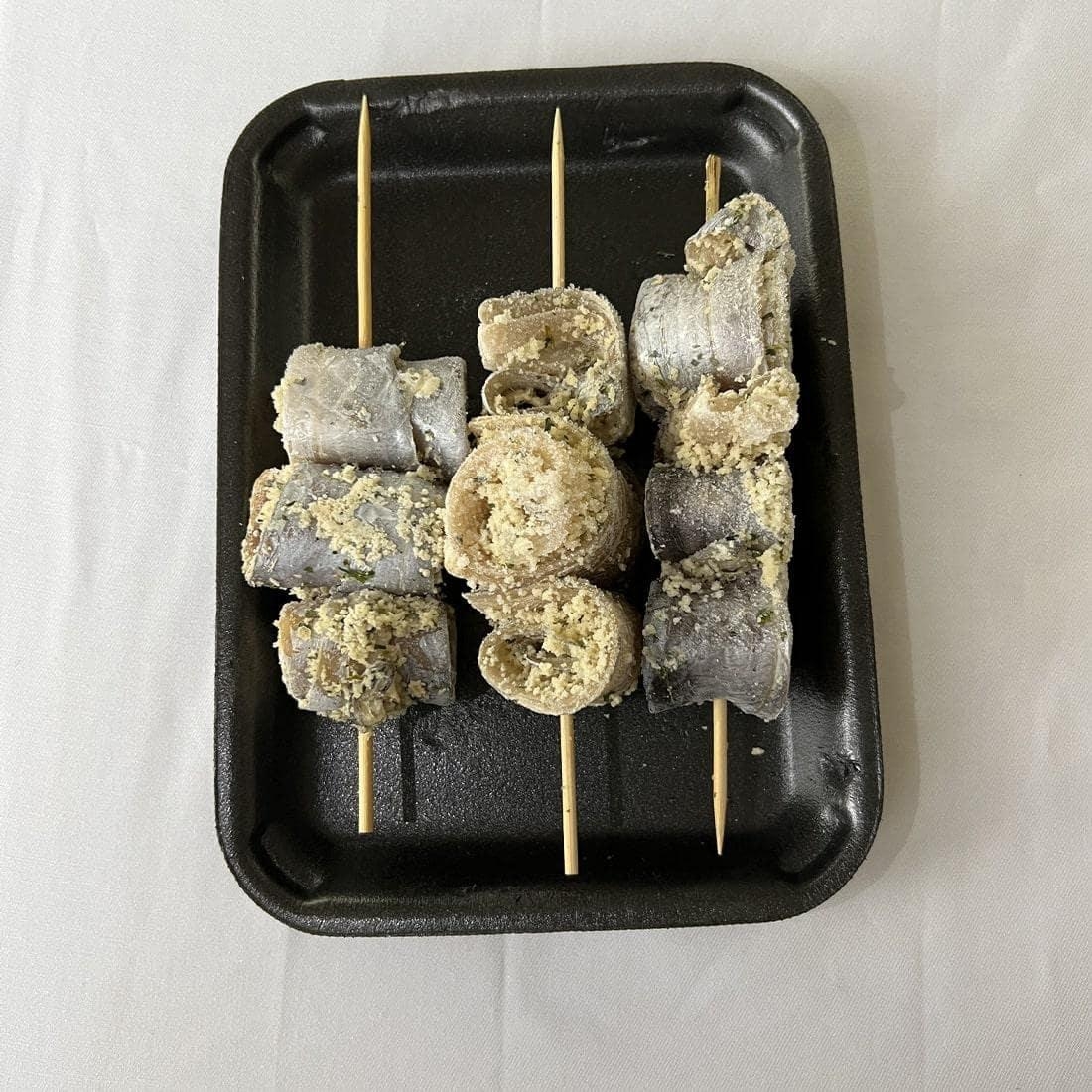 Breaded Silver scabbard fish Rolls - Cover Image